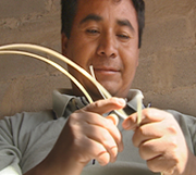 Priscilliano making a weaving