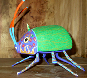 A very colorful beetle like alebrije 