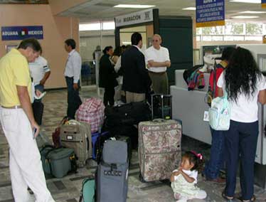 Bags and people at airport customs