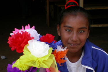 Child with paper flowers
