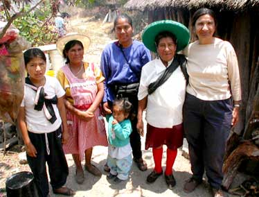 Amada Aguilares, traditional local healer and Dr. Mendoza with local villagers