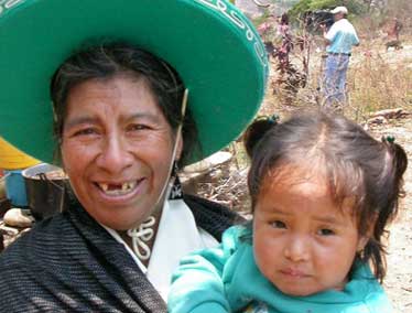 Amada Aguilares, local healer holding patients daughter