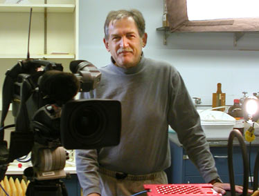 Patrick with camera in a room