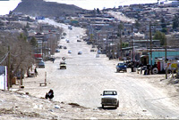 Down a dirt road in the border town