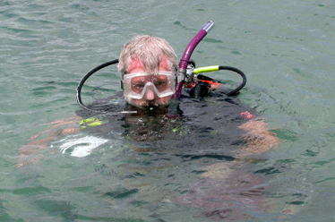 Dr Bill Gerwick in scuba gear in the water