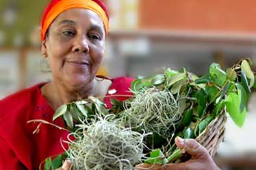 Dinah holding a basket of plants