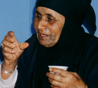 Traditional Beduin healer holding a cu[