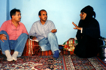 Patrick, Mohammed, and Om sitting on the cushions and talking